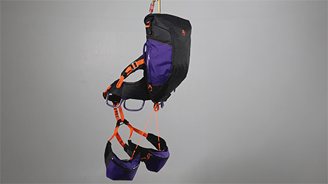 Gear-carrying system; a pack without shoulder straps that integrates directly with a climbing harness.