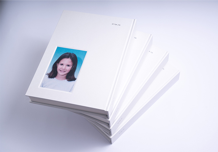 Multiple copies of the book stacked together, with the front cover displayed on the top copy.