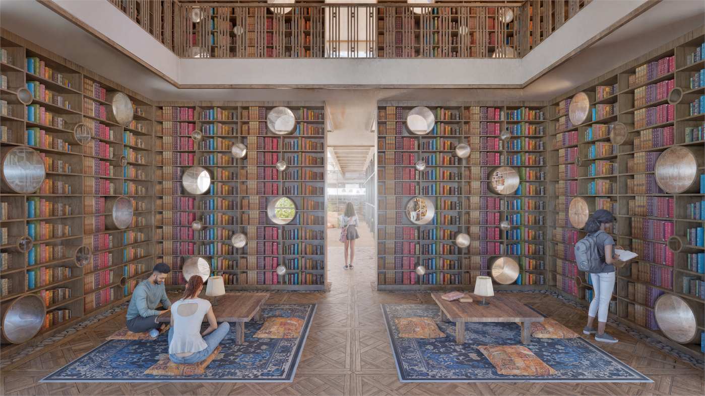 Library featuring group study areas and openings that bring natural light into the space